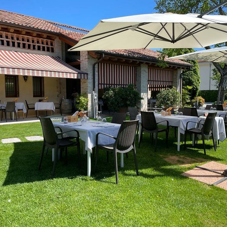 Tables in the garden with parasol