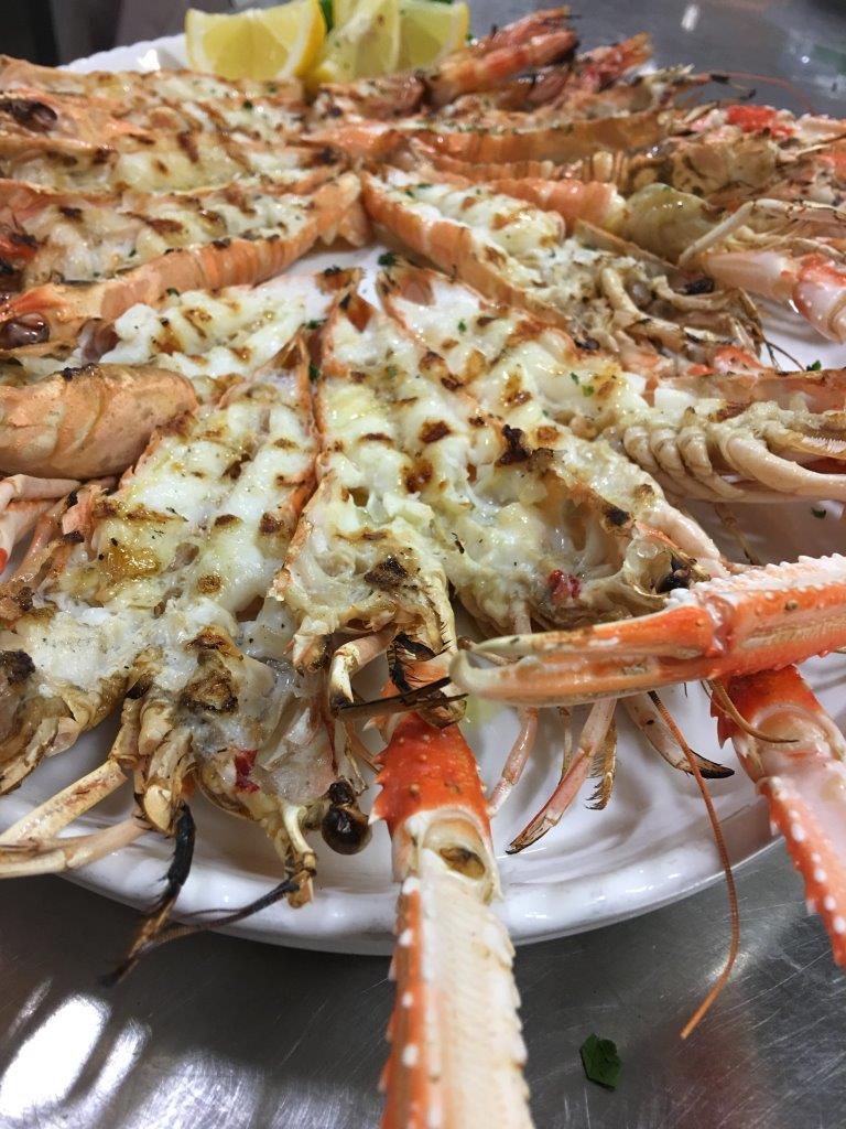 scampi alla griglia serviti in ristorante di pesce a Treviso e provincia