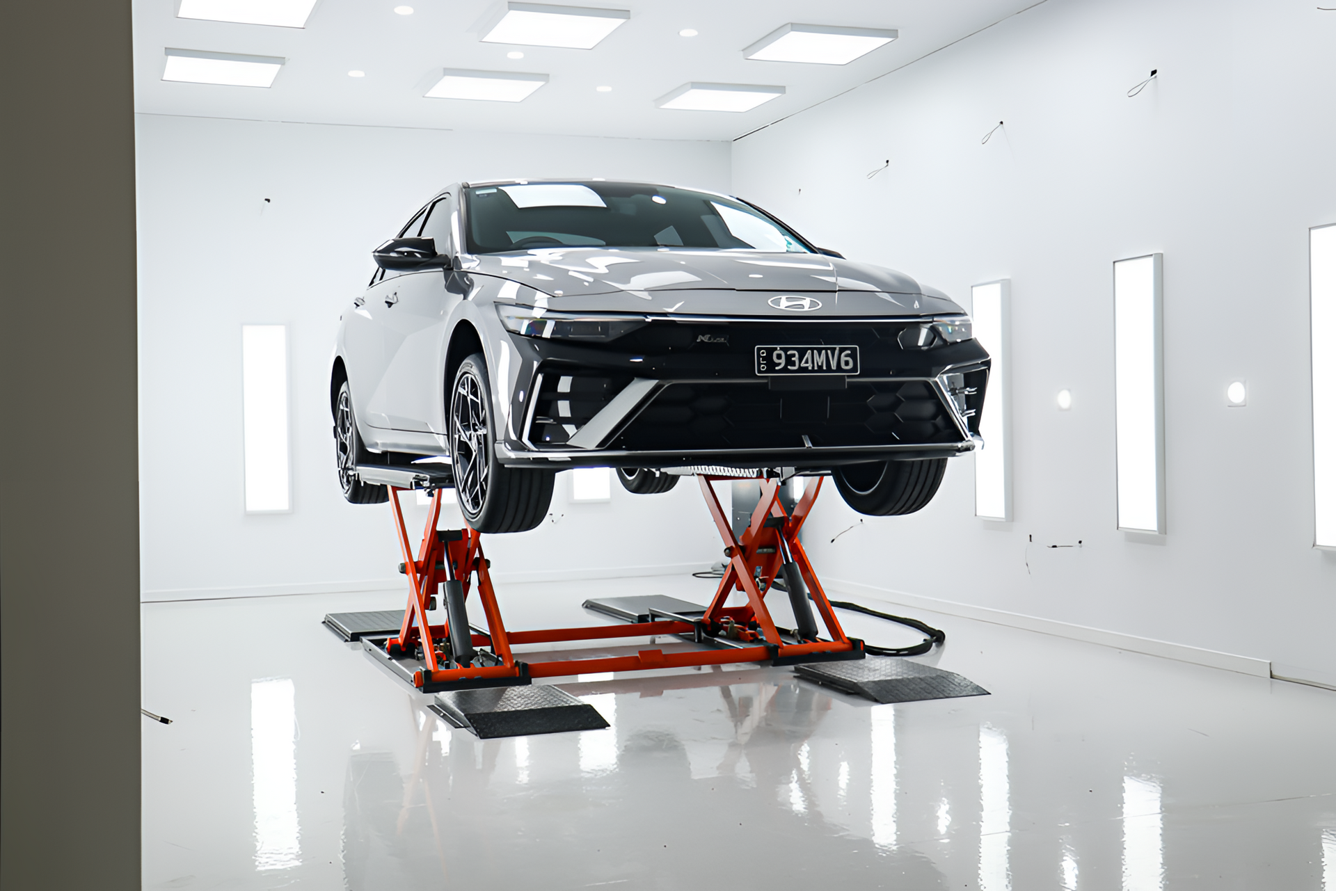 Luxurious car interior featuring tan leather seats, black accents, and silver trim.