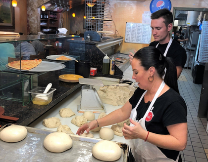 Picture of workers making pizza dough