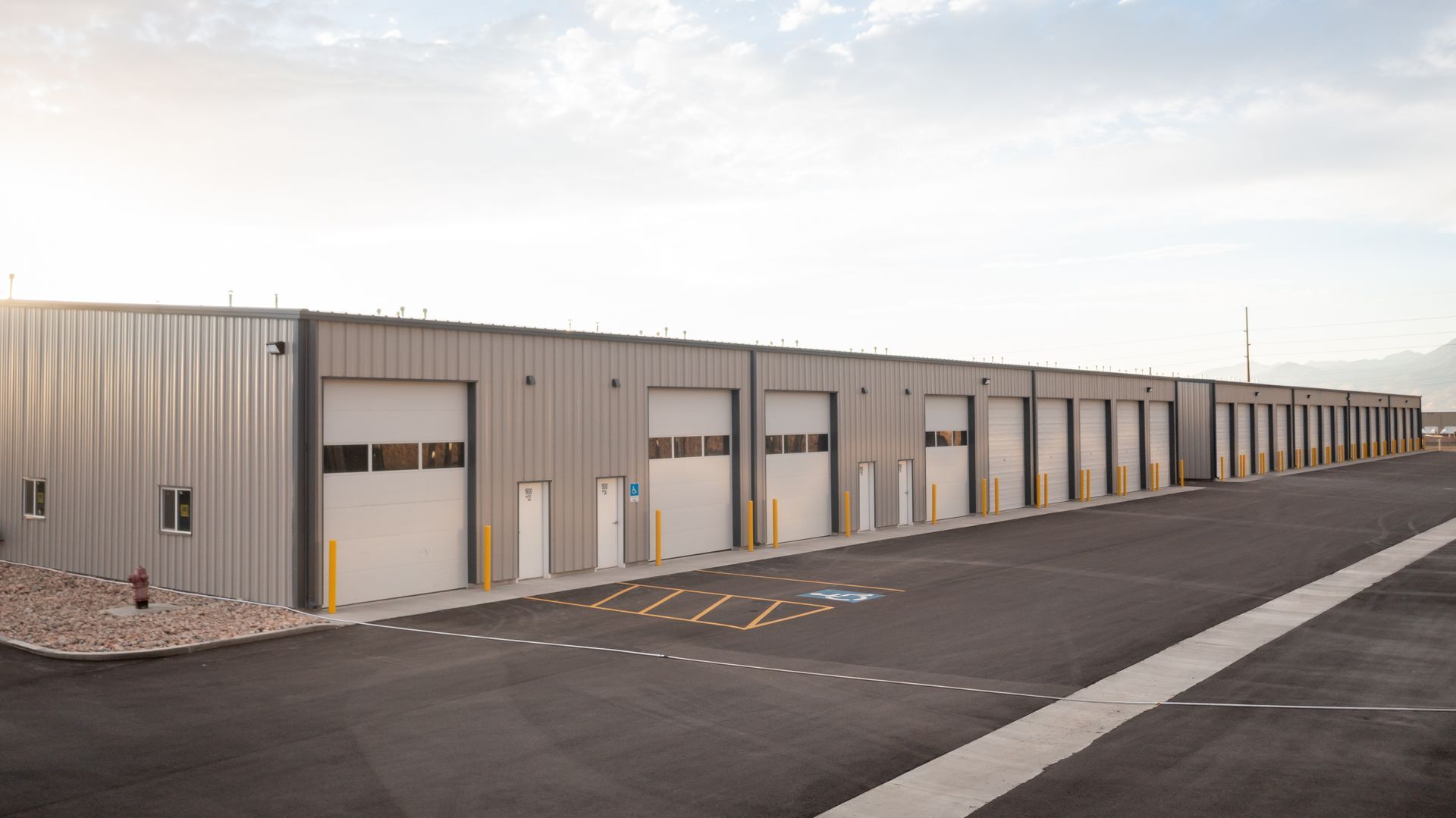 A row of storage units along a road.