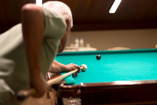 Senior Man Playing Snooker — Greenville, MI — Billiard Recovery Service