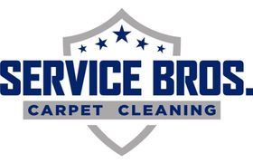 Hexagon logo with mountains, trees, and campfire in orange and blue.