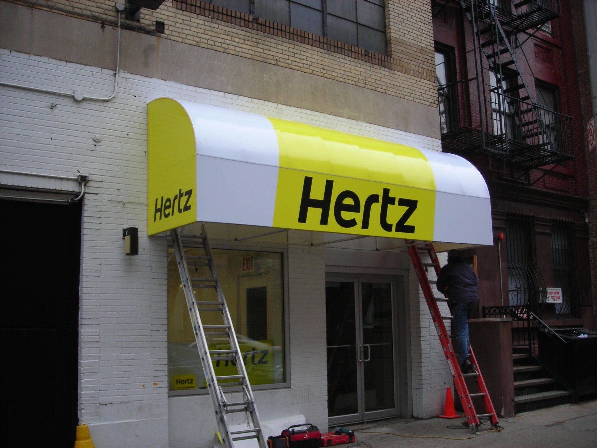 business awning sign for hertz
