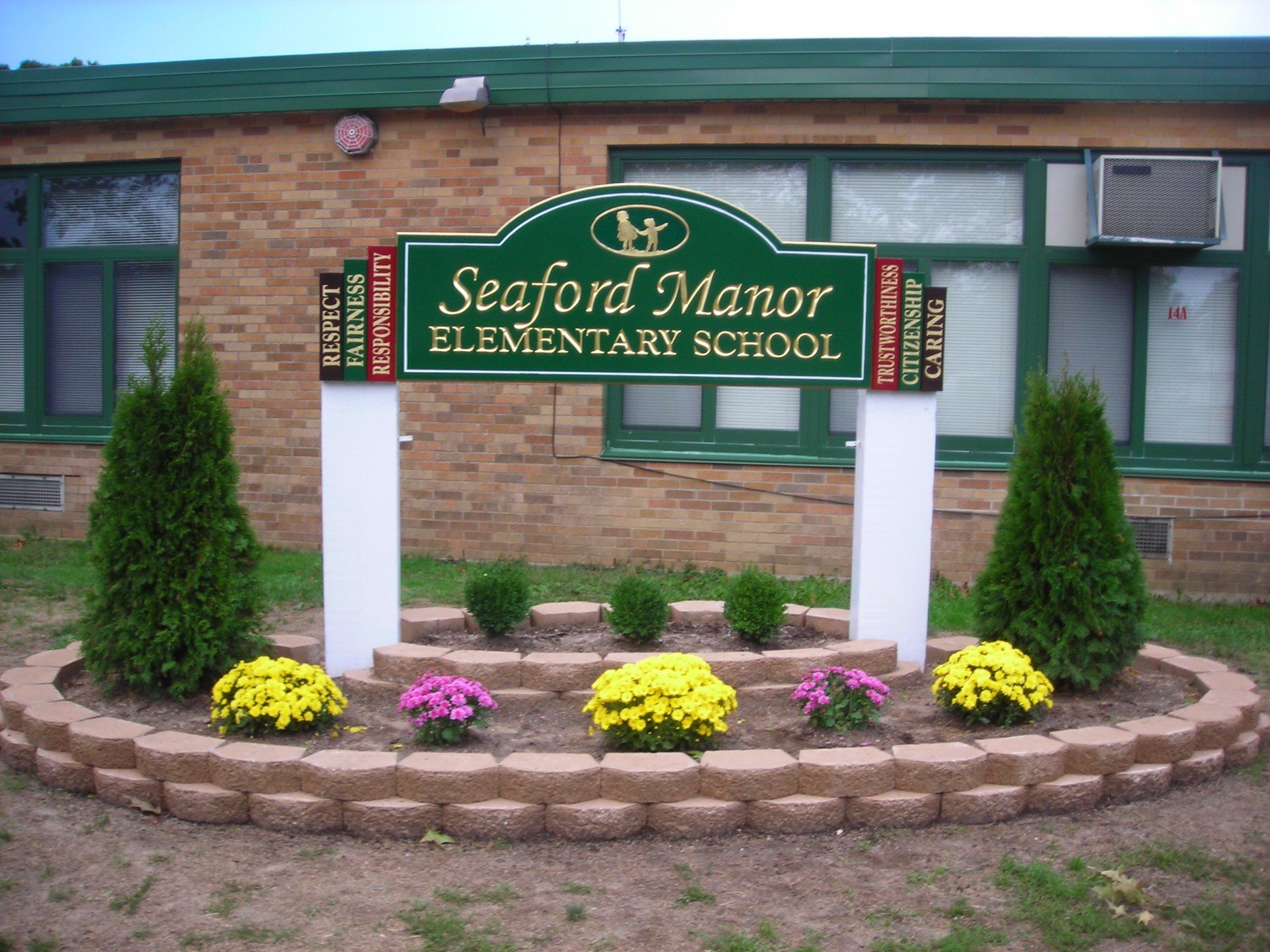 gold leaf wood carved sign by dezant signs
