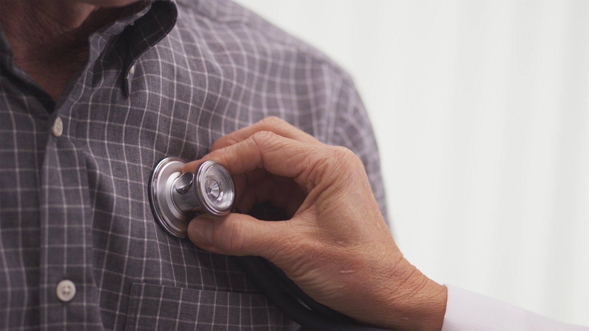 Close-up of doctor checking patient's vitals