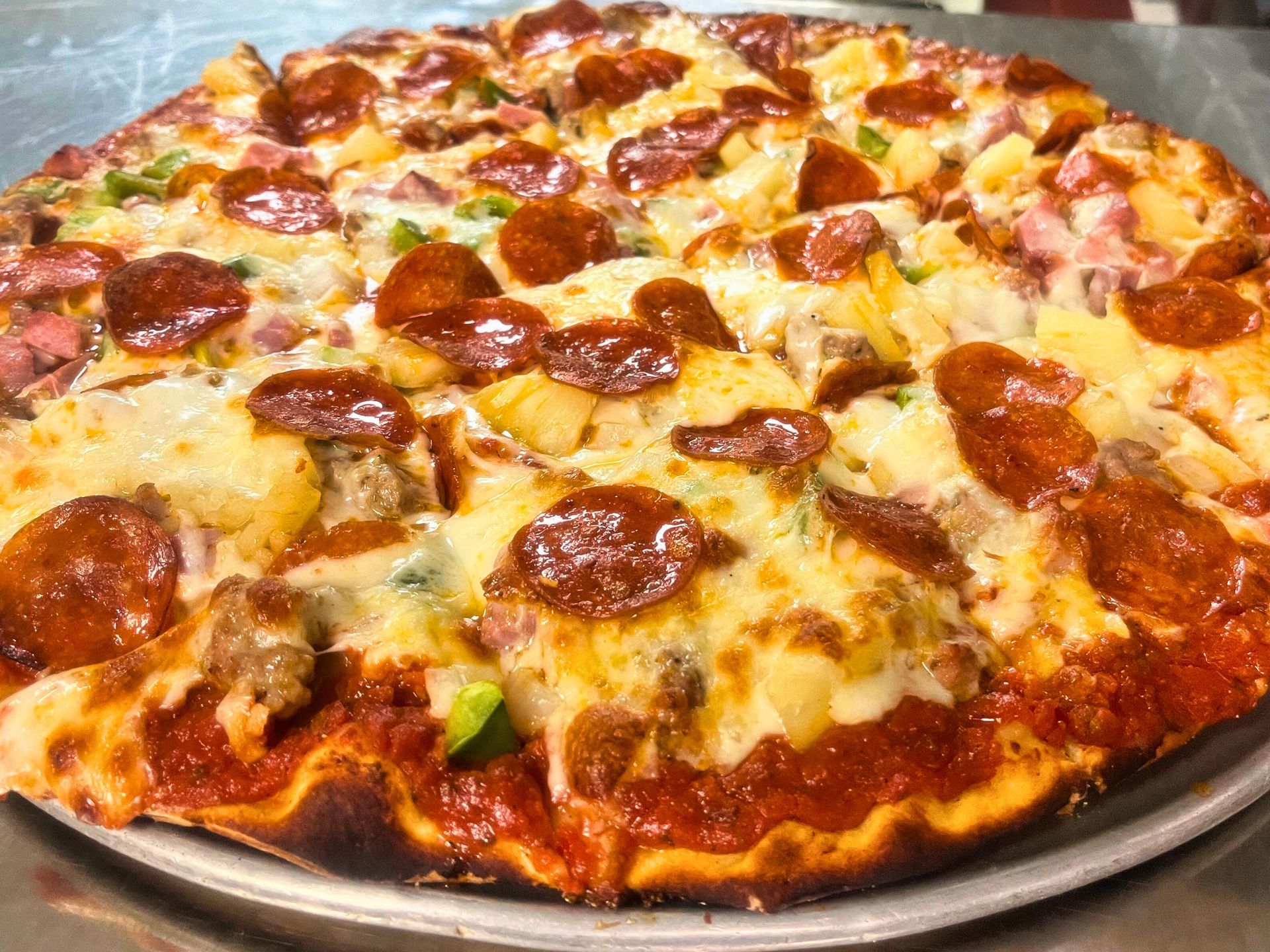 Dockers supreme pizza with pineapple