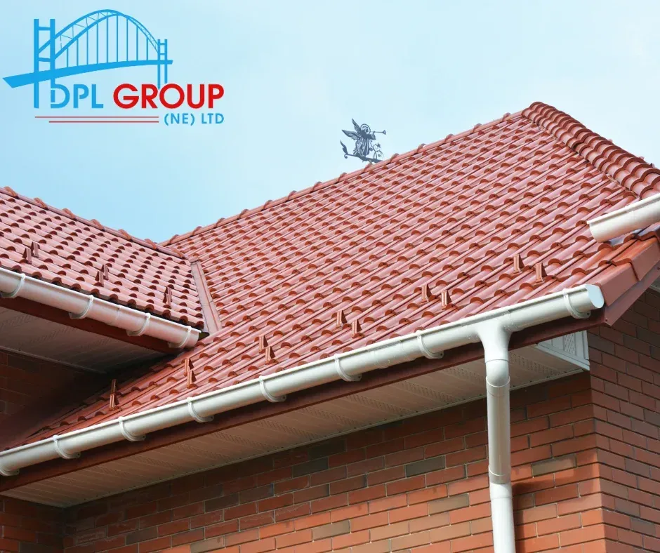Red tiled roof with white gutters on a brick house under a blue sky, DPL Group logo in top left