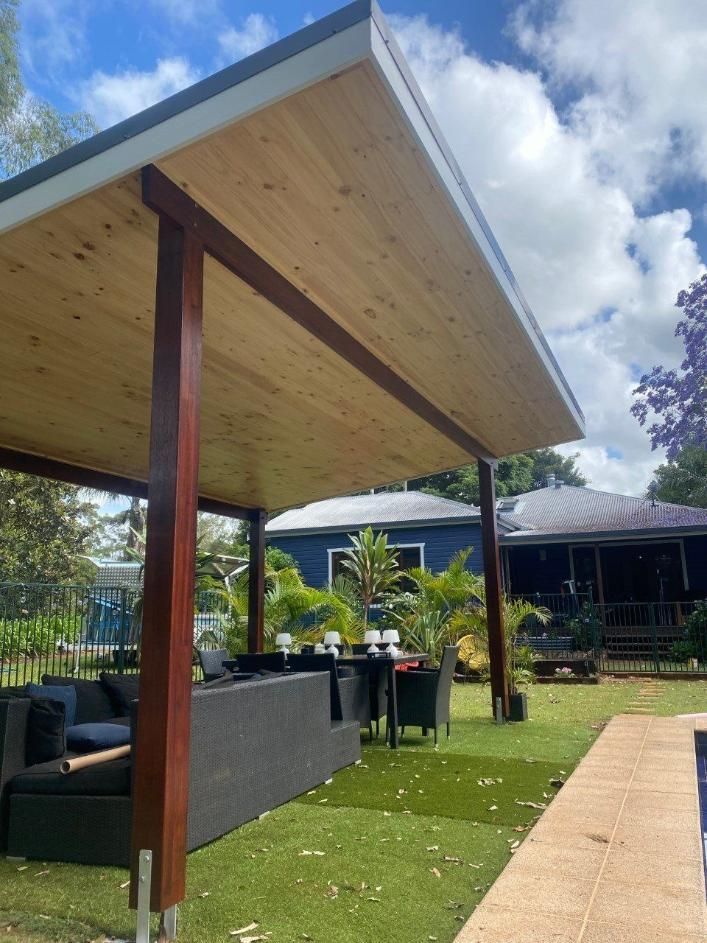 A Patio Area With A Wooden Roof And A Couch — Donnelly Painting In Wollongbar, NSW