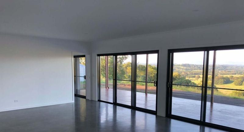 A Large Empty Room With Lots Of Windows And A View — Donnelly Painting In Wollongbar, NSW