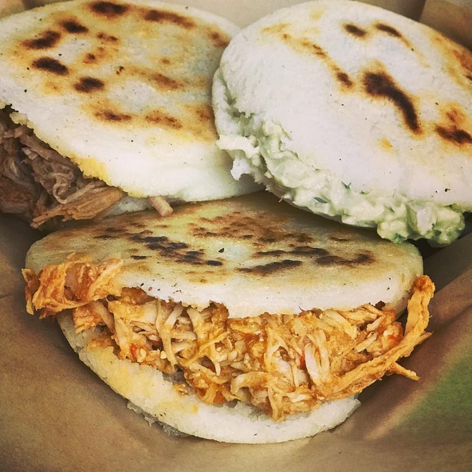 A close up of three sandwiches on a table
