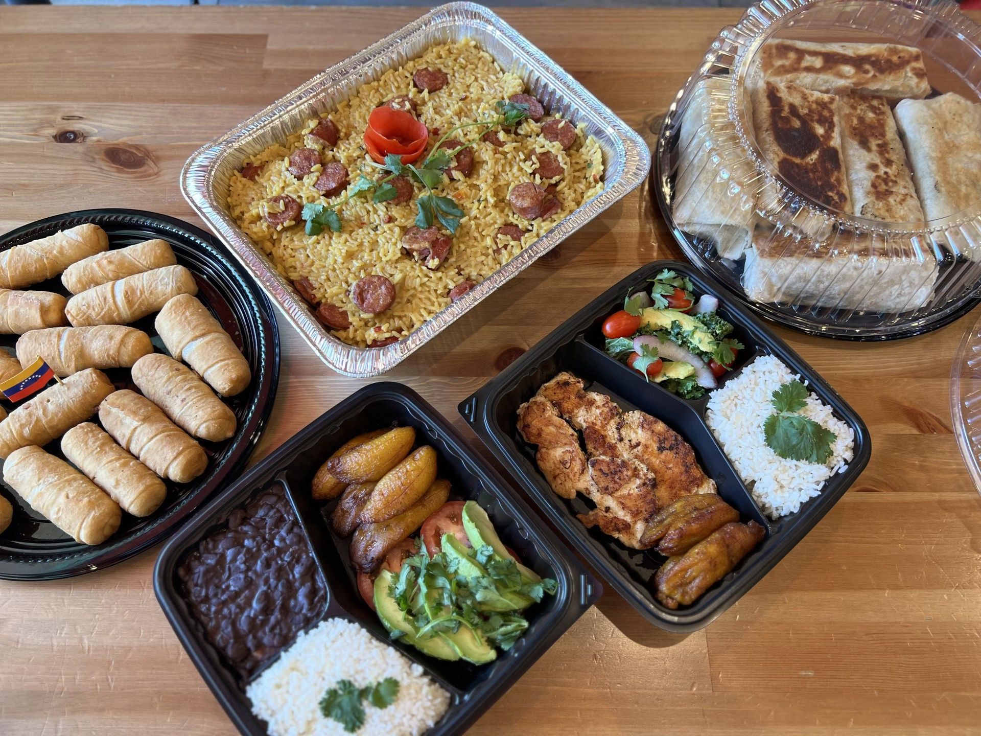 A plate of food with rice and tomatoes on it
