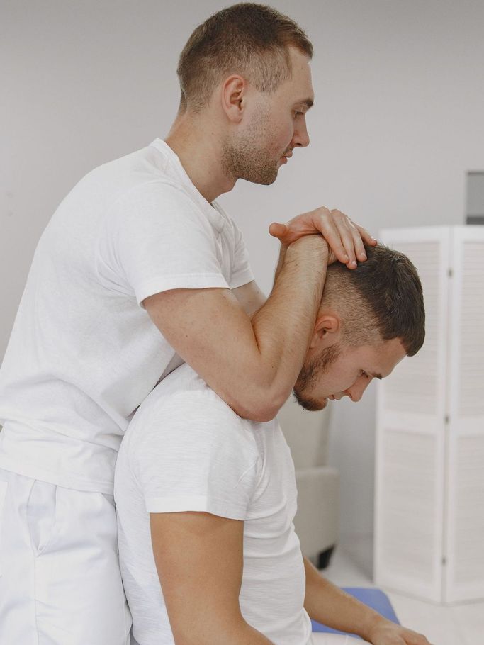 man giving chiropractic treatment
