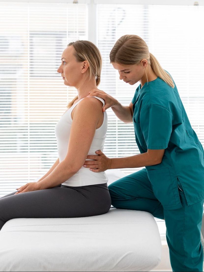 chiropractor examining back