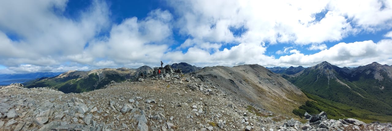 a view of a mountain range from the top of a mountain .