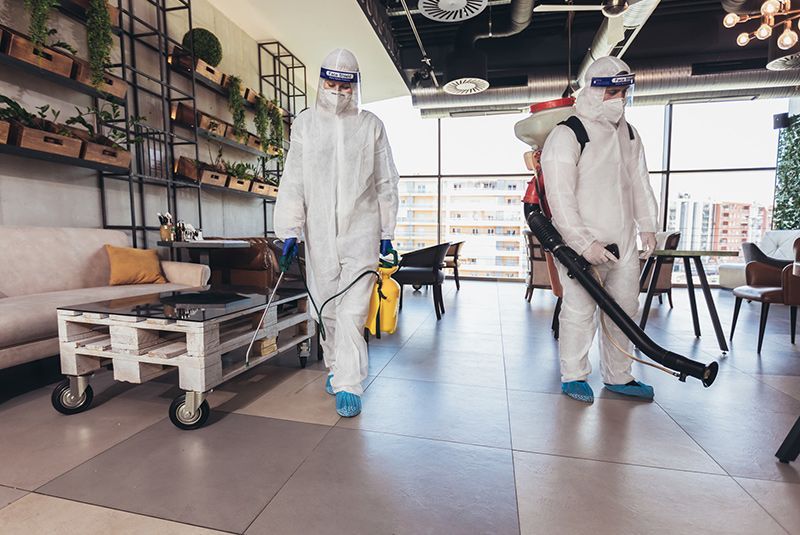 Workers Disinfecting An Apartment — Charleston, SC — Low Country Remediation Workers Disinfecting An Apartment — Charleston, SC — Low Country Remediation