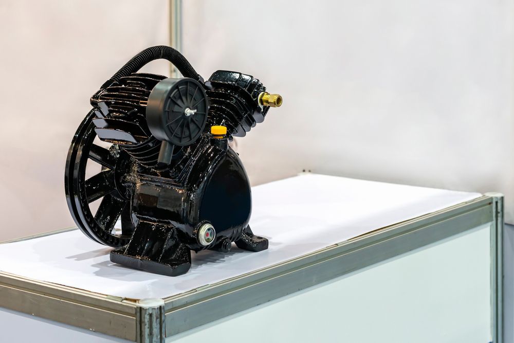 Black Mechanical Device With Fan-like Wheels — Air & Lift Gear in Buderim, QLD