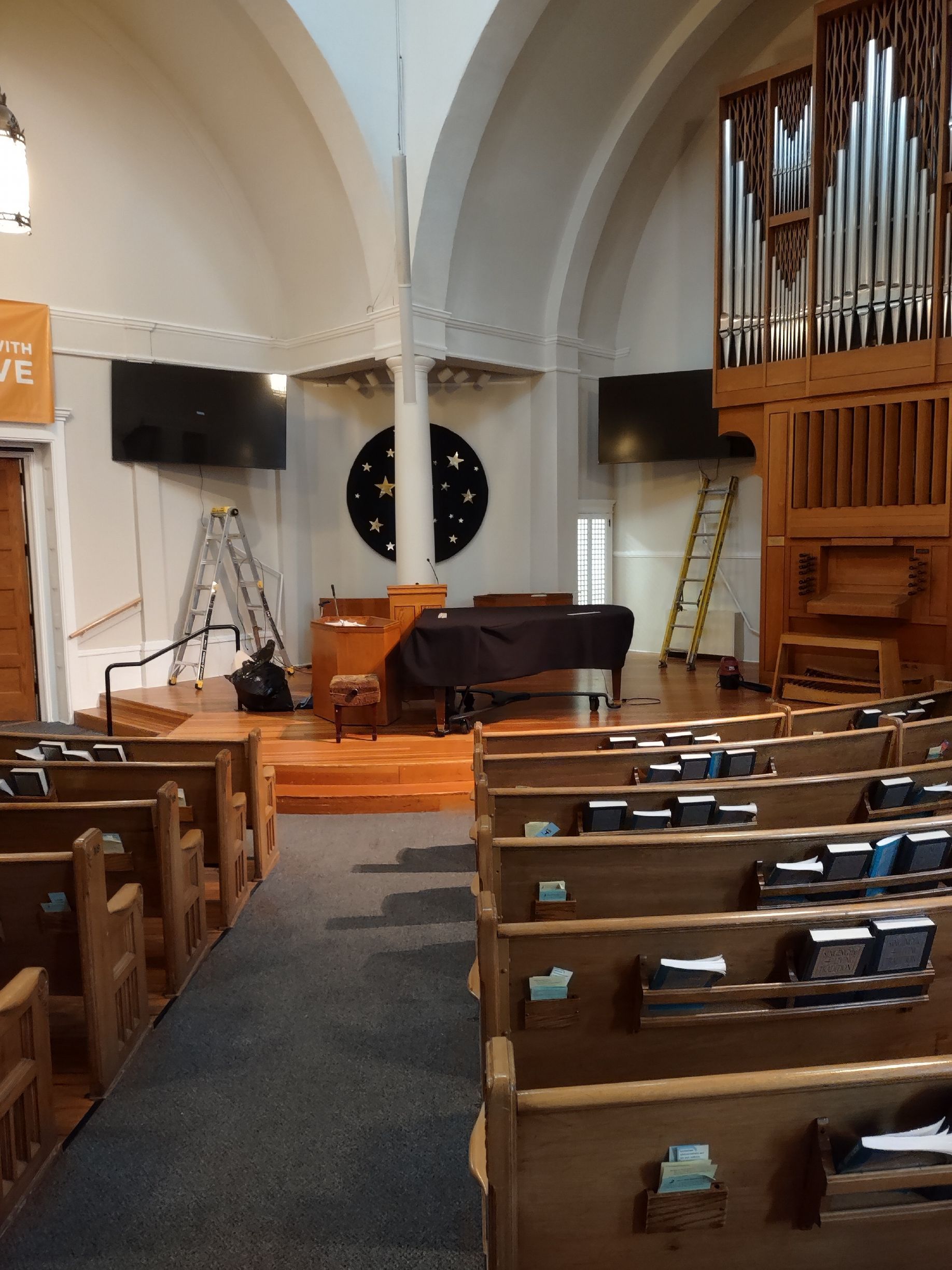 The inside of a church with a sign that says love