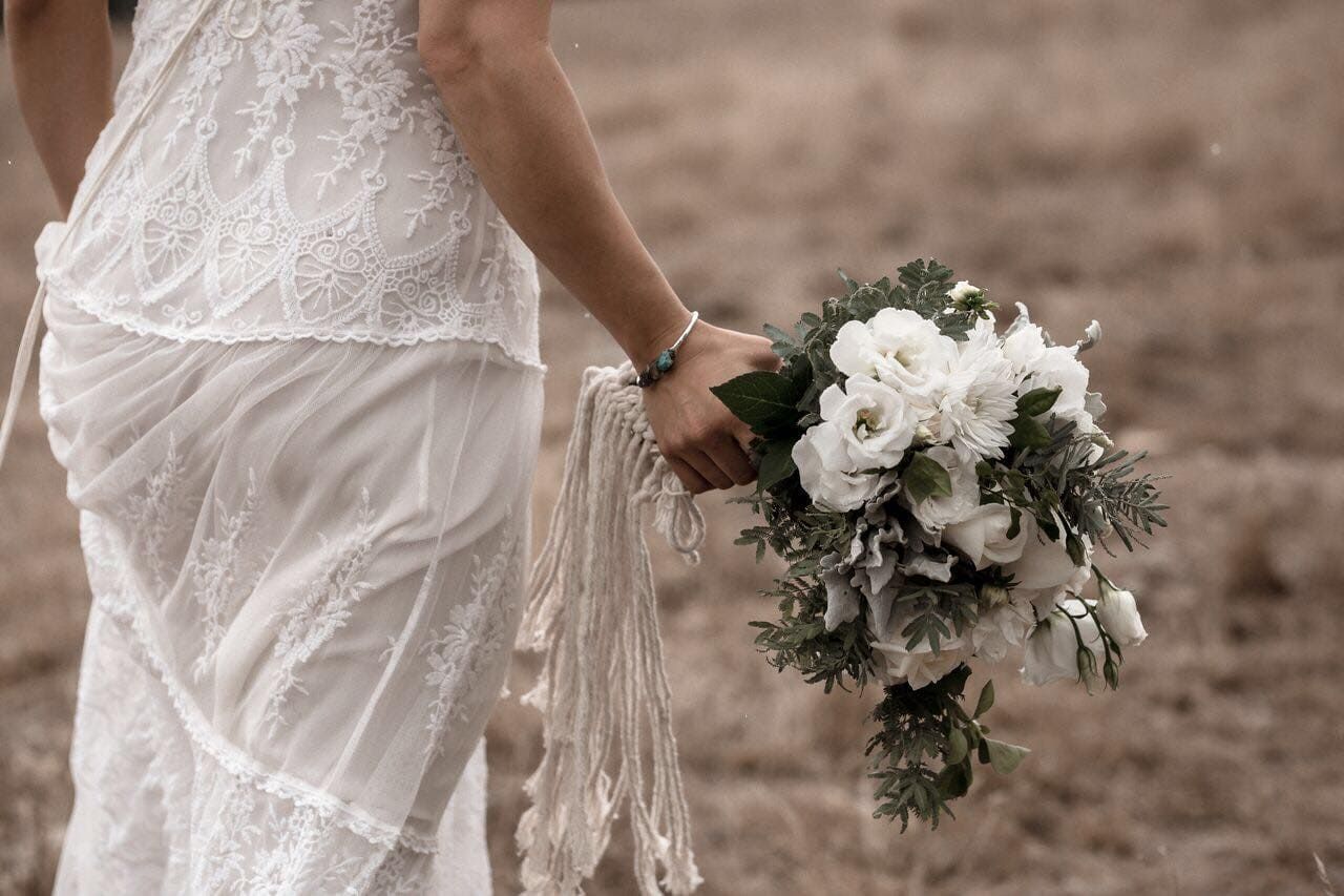 A Bride In A White Dress Is Holding A Bouquet Of White Flowers — Hello Poppy Lane Florist In Albury, NSW