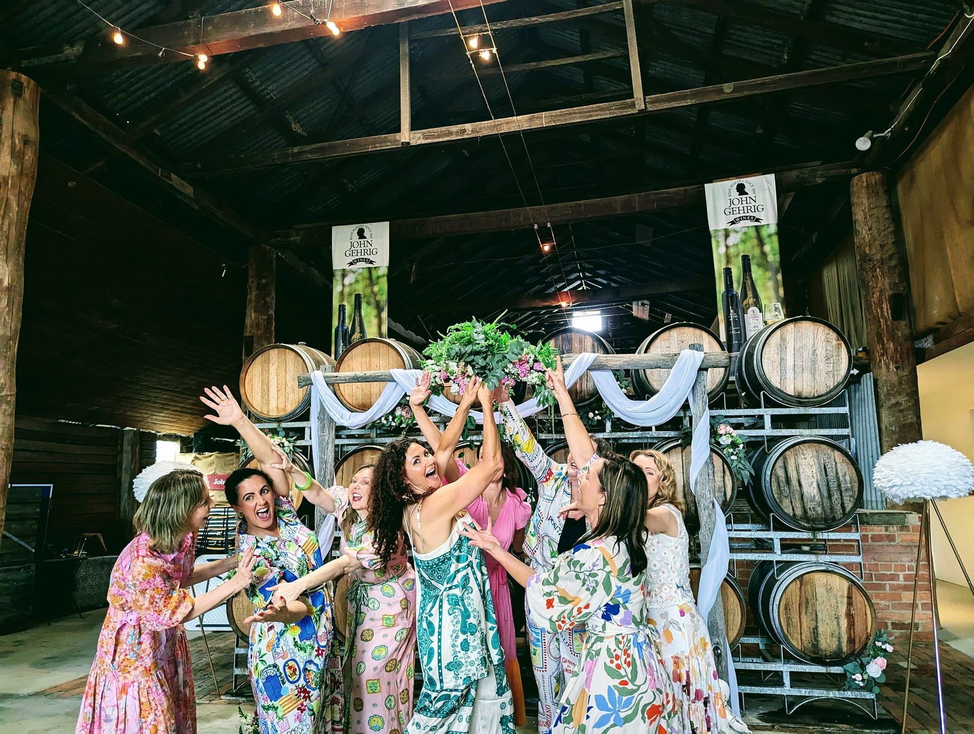 A Person Wearing a Hat is Standing Next to a Bunch of Yellow Flowers — Hello Poppy Lane Florist In Albury, NSW