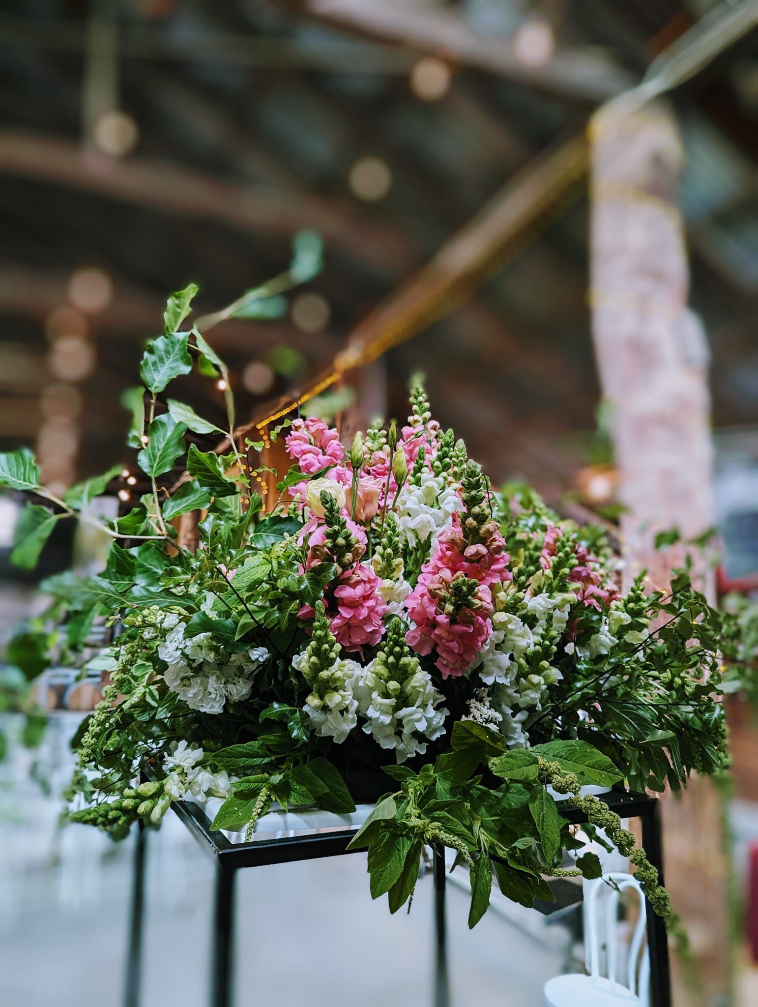 A Person is Holding a Bouquet of Pink Flowers — Hello Poppy Lane Florist In Albury, NSW