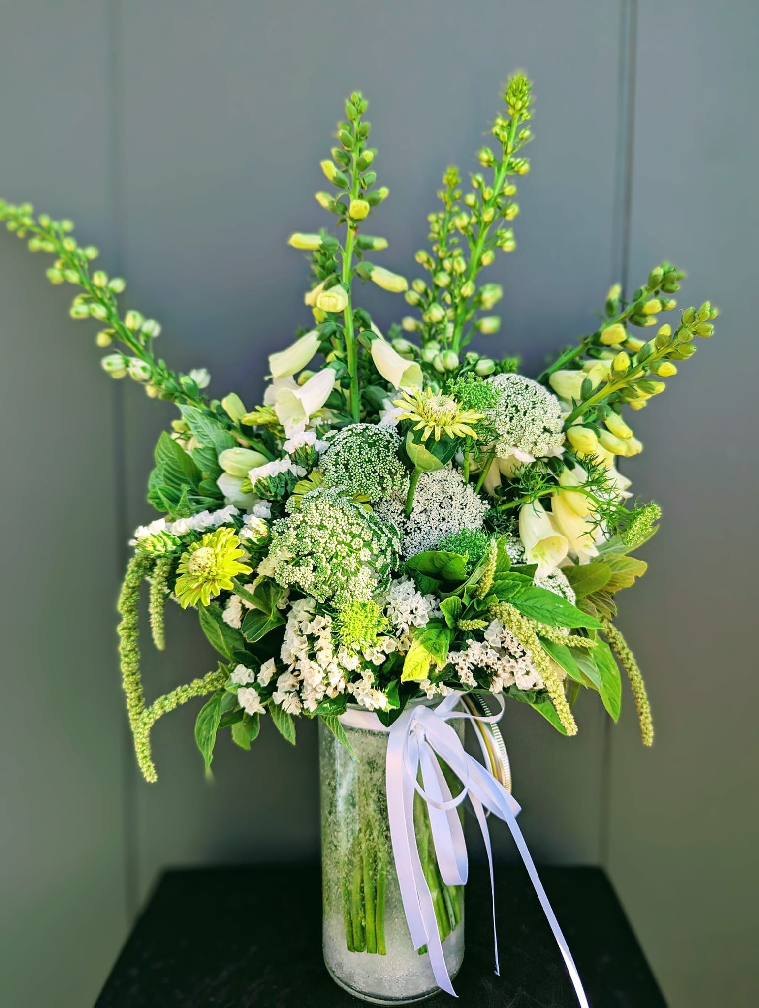 A Close Up of a Pink and Yellow Flower With Water Drops on It — Hello Poppy Lane Florist In Albury, NSW