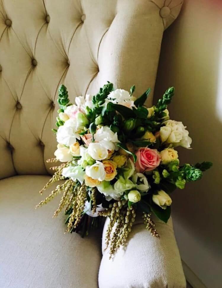 A Bouquet of Flowers is Sitting on a Couch — Hello Poppy Lane Florist In Wodonga, VIC