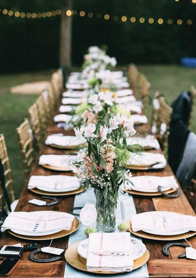 A Long Wooden Table With Plates, Napkins, and a Vase of Flowers on It — Hello Poppy Lane Florist In Wodonga, VIC