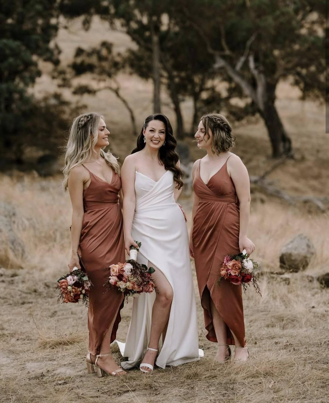 A Bride and Her Bridesmaids Are Posing for a Picture in a Field — Hello Poppy Lane Florist In Wodonga, VIC