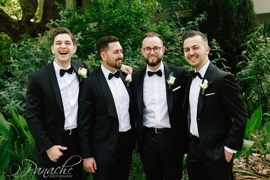 A Group Of Men In Tuxedos And Bow Ties Are Posing For A Picture — Hello Poppy Lane Florist In Albury, NSW