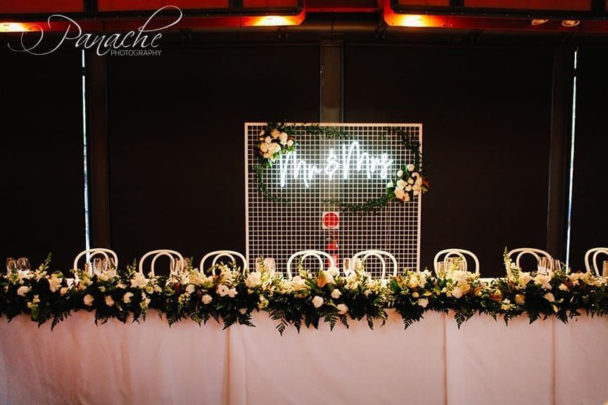 A Long Table With Flowers And A Neon Sign That Says Mr. And Mrs. — Hello Poppy Lane Florist In Albury, NSW