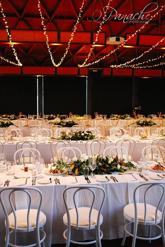 A Large Room With Tables and Chairs Set Up for a Wedding Reception — Hello Poppy Lane Florist in Rutherglen, NSW