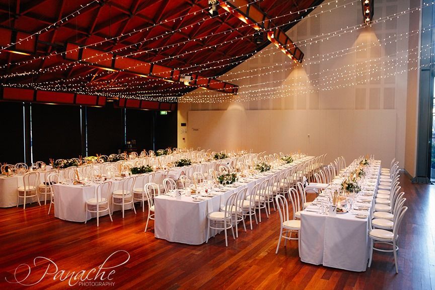A Large Room With Tables and Chairs Set Up for a Wedding Reception — Hello Poppy Lane Florist in Rutherglen, NSW
