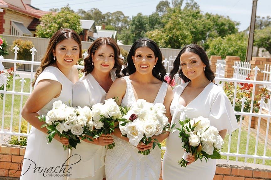 A Bride And Groom Are Sitting In The Back Seat Of A Car — Hello Poppy Lane Florist In Albury, NSW