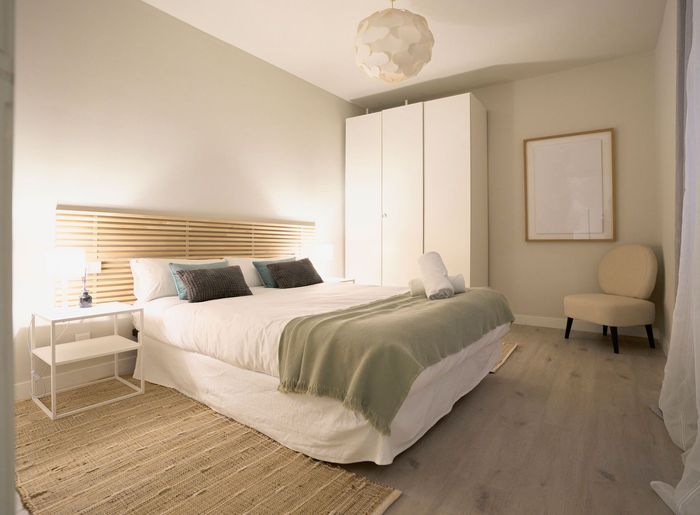 Wide Bedroom with Wooden Flooring