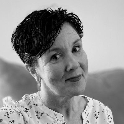 A black and white photo of a woman with short hair