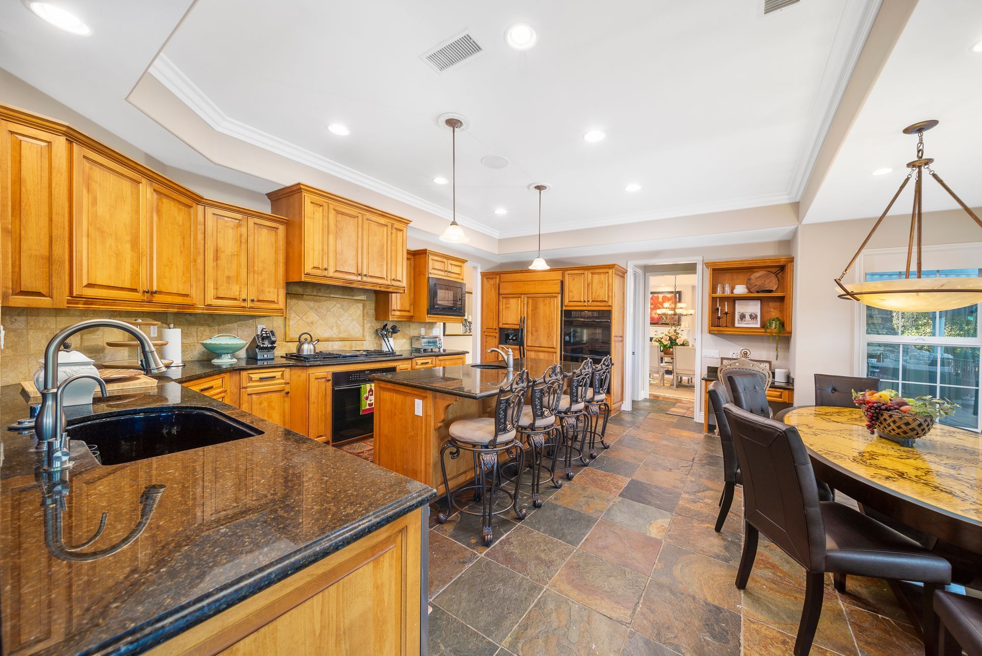 A game room with a foosball table and a basketball hoop.