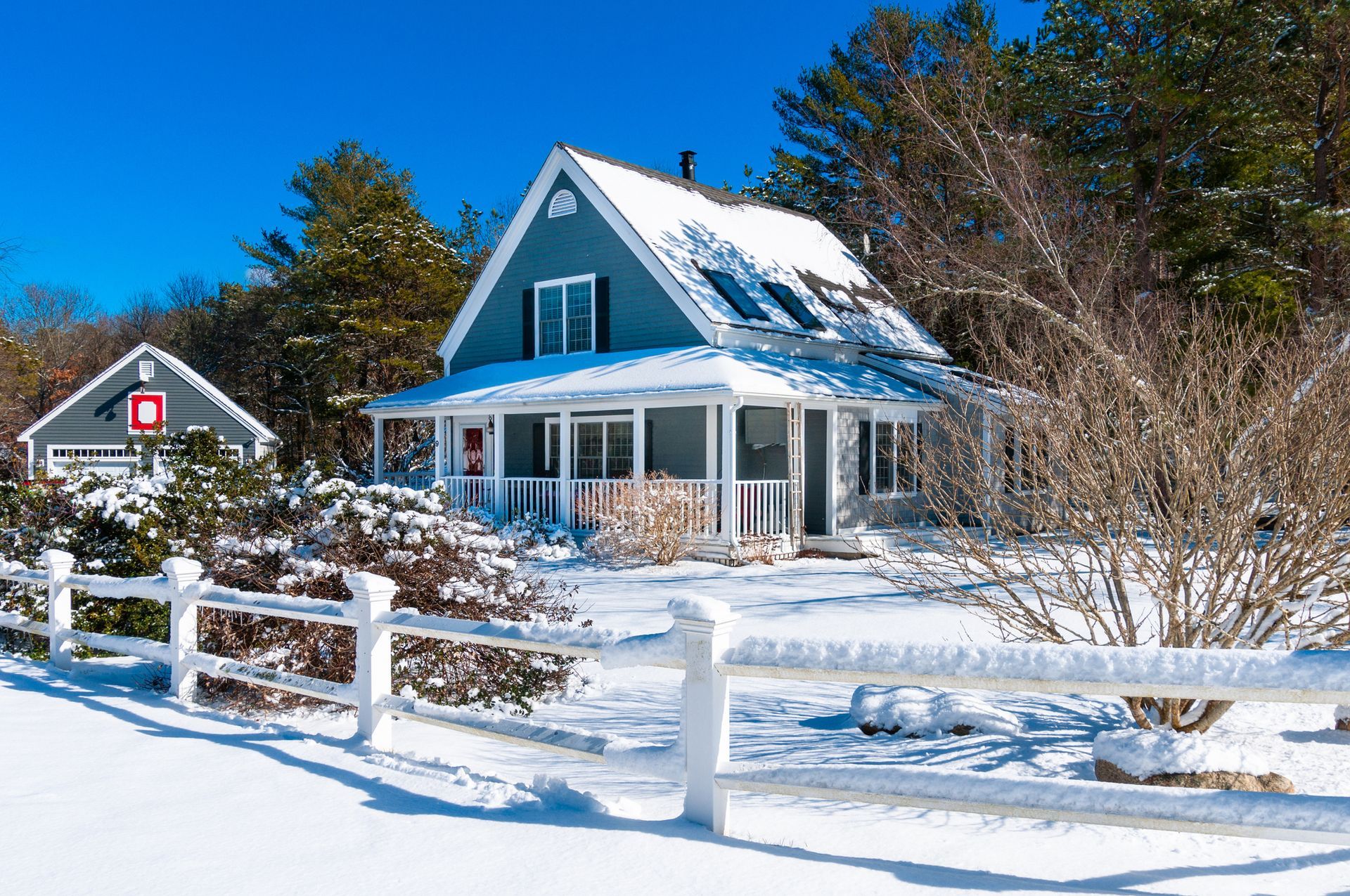 Snowy House with a Fence — Dalton, MA — Mockingbird Real Estate LLC