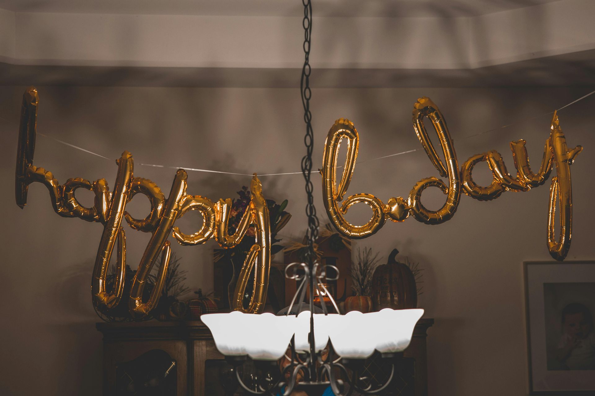 Gold script balloons spelling 