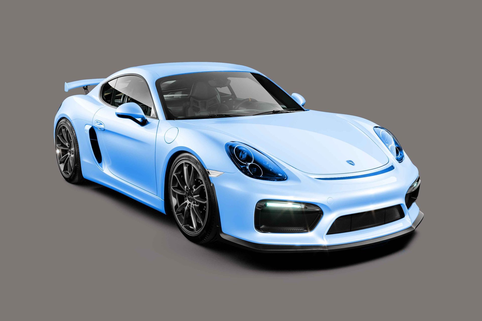A blue porsche 911 gt4 rs is on a gray background.