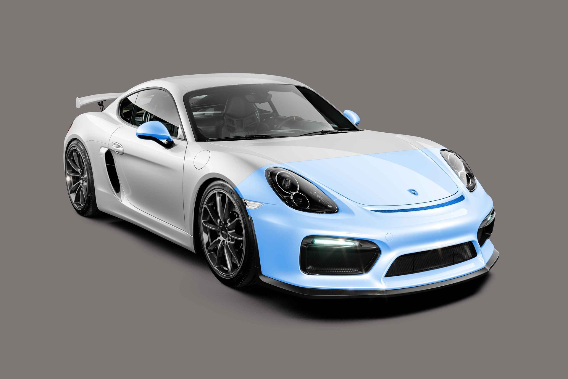 A white porsche 911 gt4 rs with a blue stripe on the front.