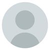A gray circle with a person 's face in it.