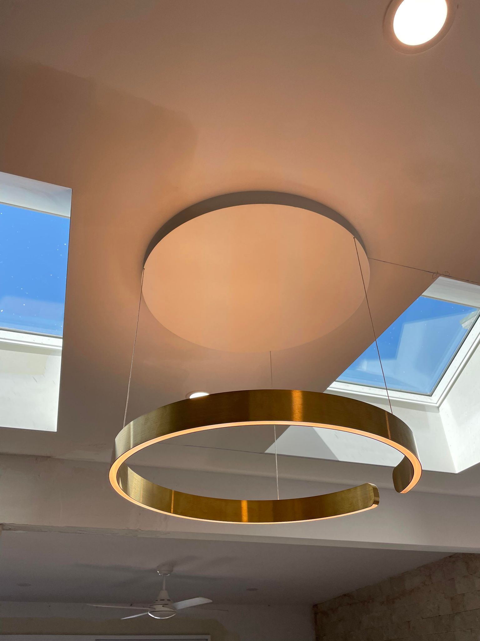 A Modern Light Fixture Hanging From The Ceiling— TB Electrical & Communications in Erina, NSW