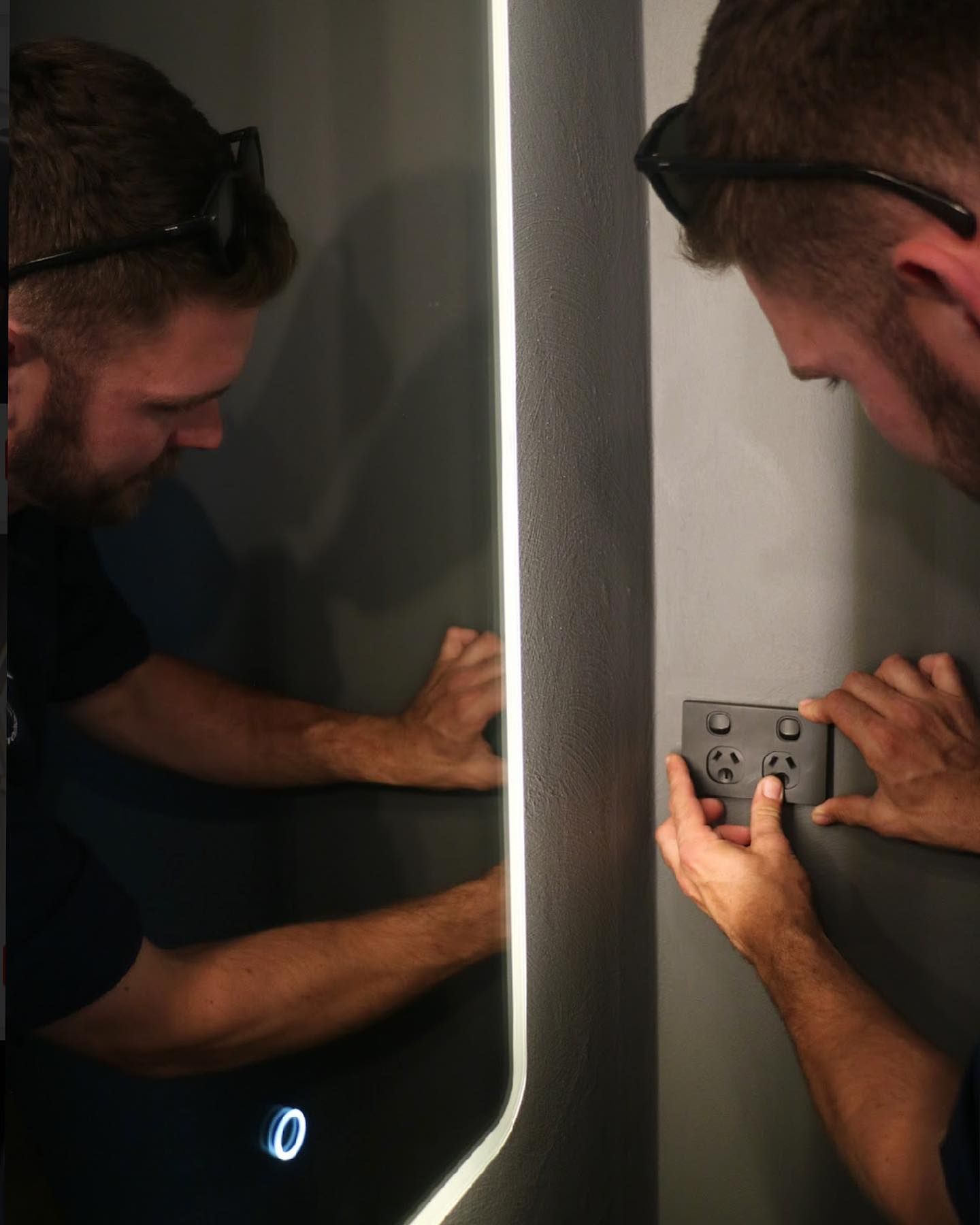 Electrician Adjusting Light Switch — TB Electrical & Communications in Erina, NSW