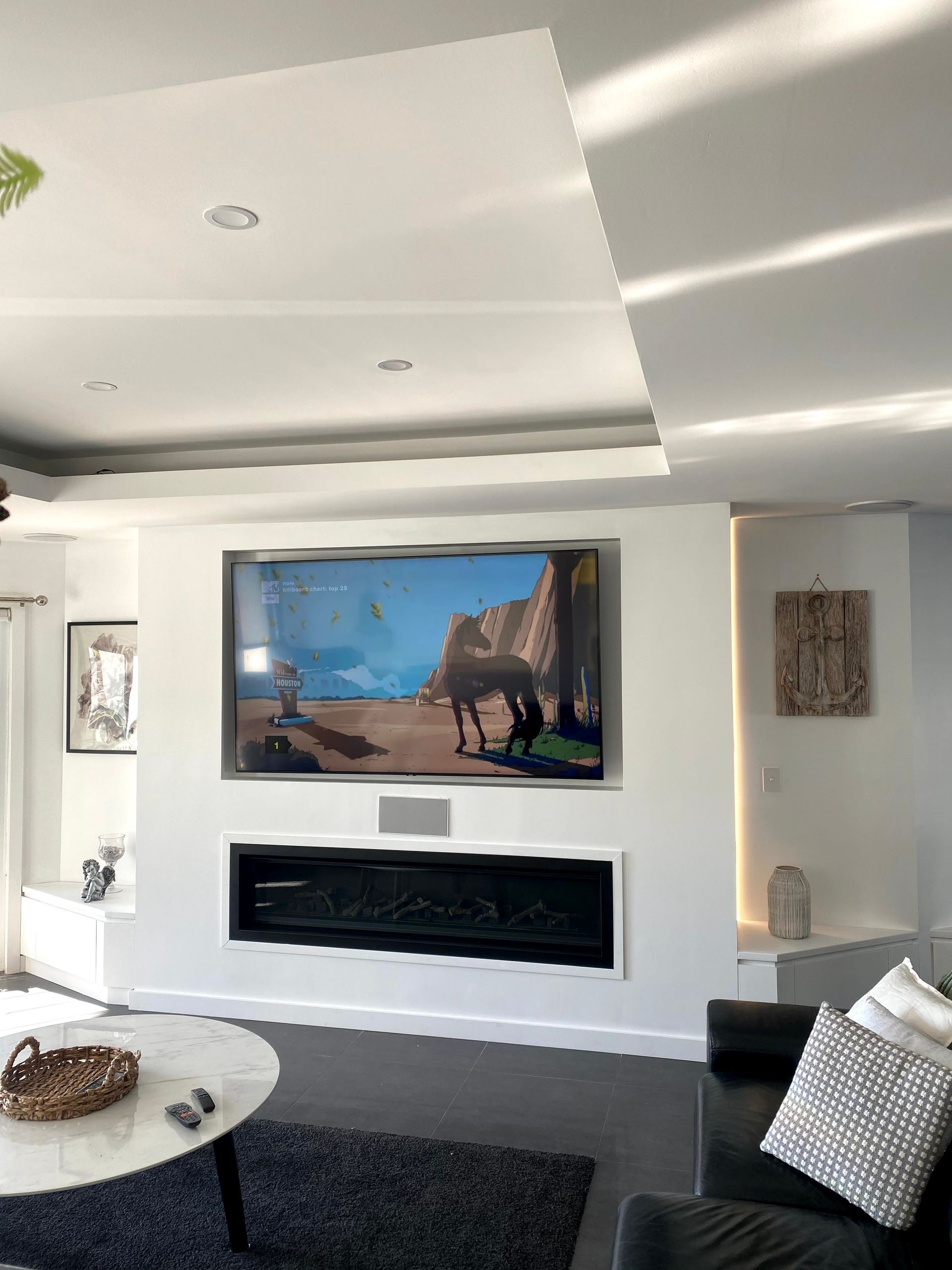 A Living Room With A Large TV On The Wall — TB Electrical & Communications in Erina, NSW