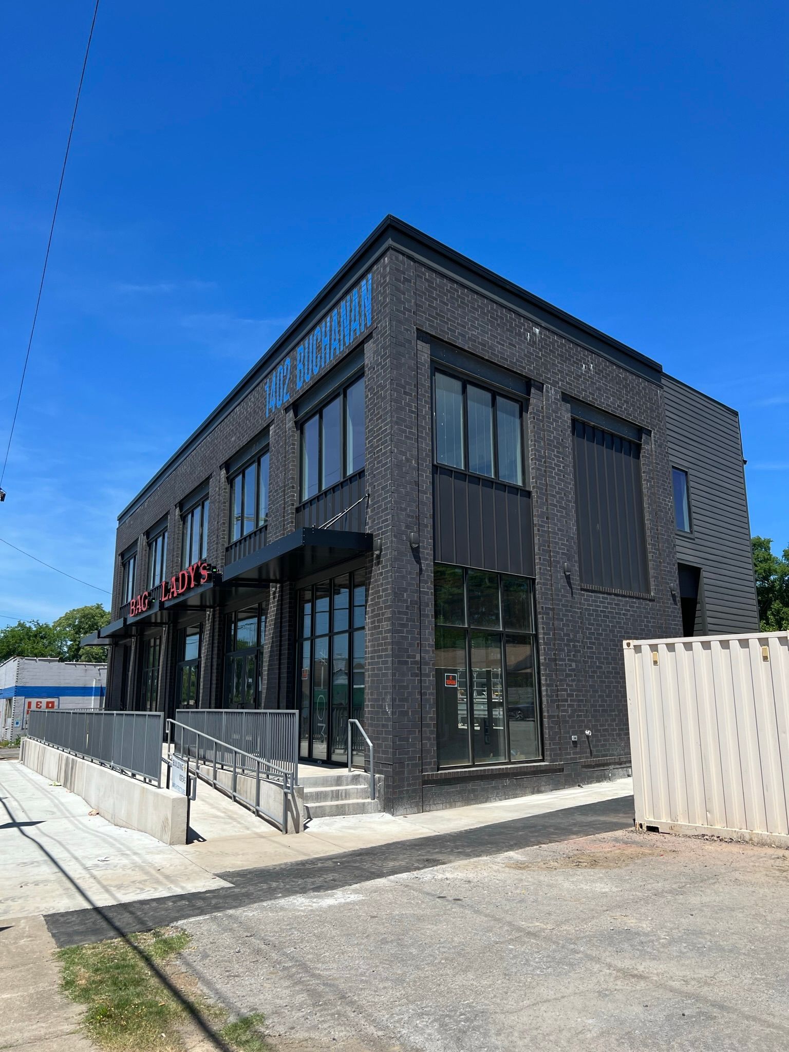 a building with a sign that says mike buchanan