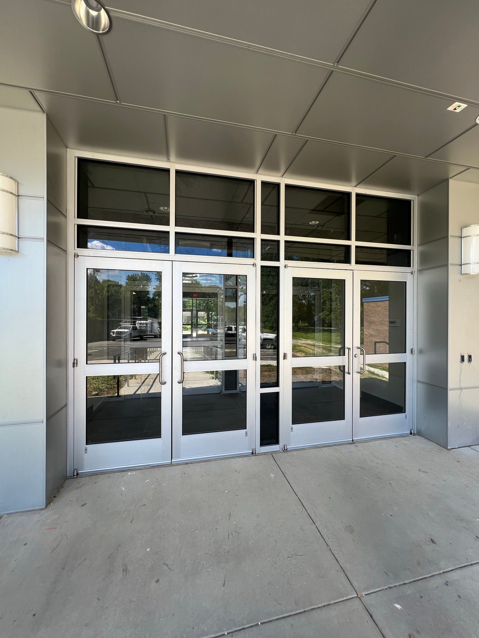 a large building with a lot of glass doors