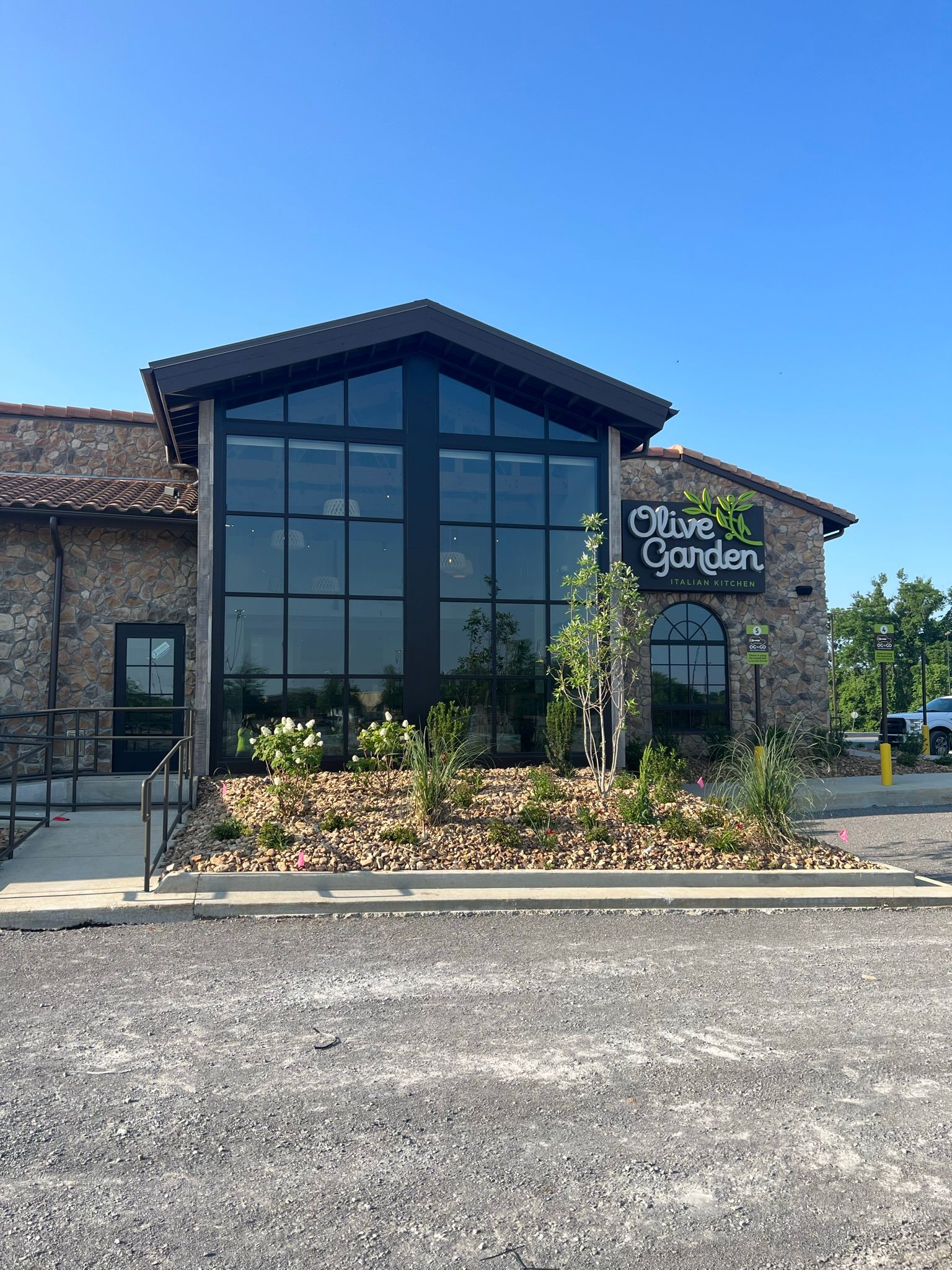 a large building with a sign that says olive garden