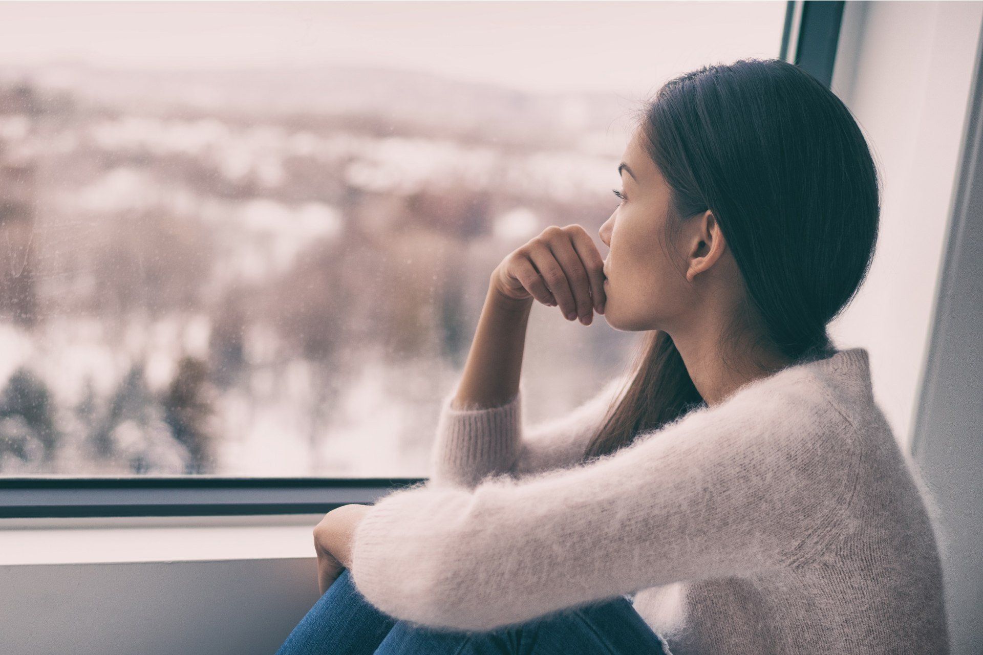 a lady looking out the window