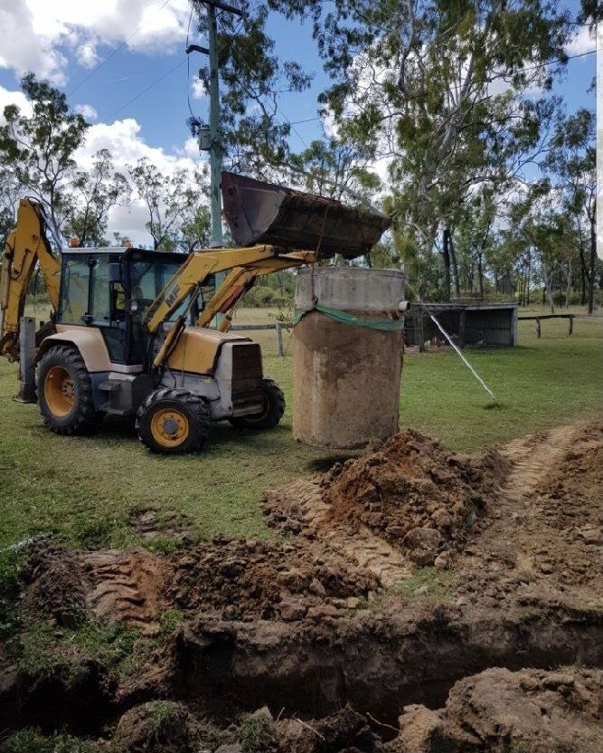 Excavator Pulling out Septic — Plumbers in Townsville, QLD